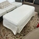 slip covered ottoman