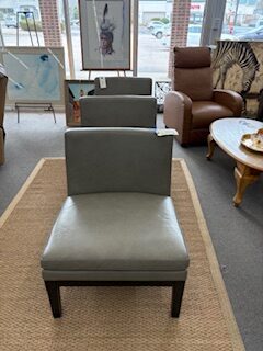 three vinyl armless chairs